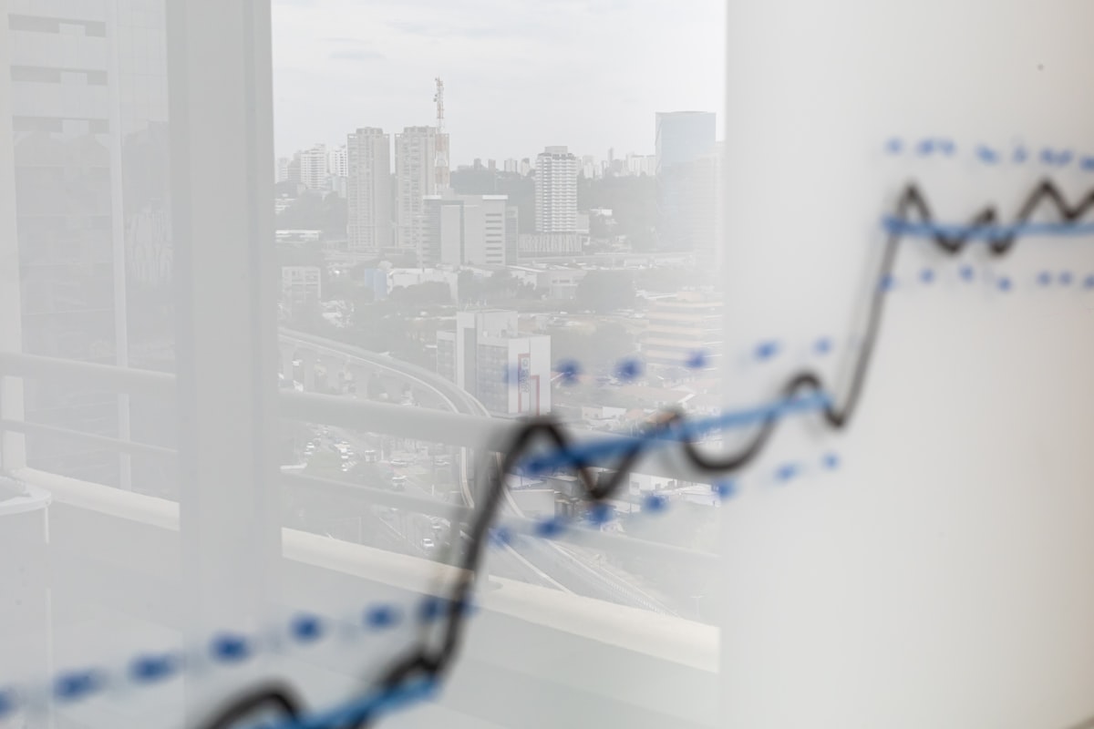 City skyline reflected on a financial growth graph